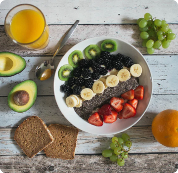 bowl of fruits toppings on yogurt